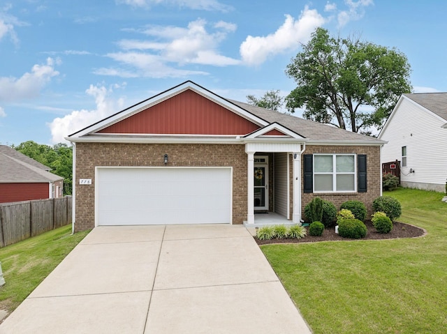 778 Prominence Rd, Columbia, TN 38401 - view of front of property featuring a garage, concrete driveway, and brick siding