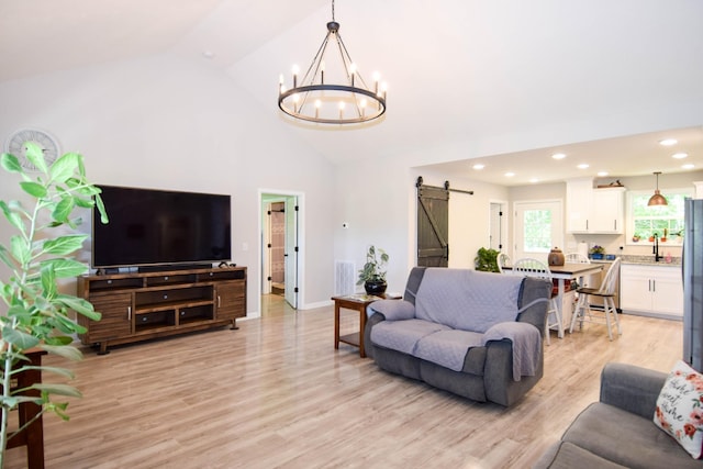 421 Marlin Ln, Westmoreland, TN 37186 - living area with a barn door, a chandelier, light wood-style floors, recessed lighting, and high vaulted ceiling