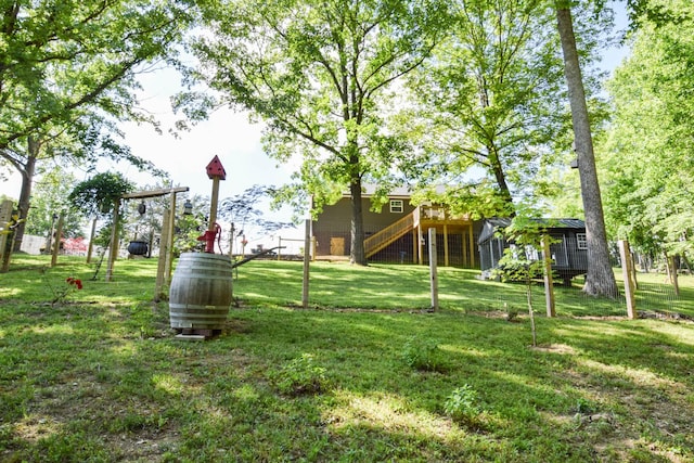 421 Marlin Ln, Westmoreland, TN 37186 - view of green lawn with stairs and a deck