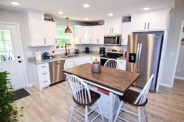 421 Marlin Ln, Westmoreland, TN 37186 - kitchen featuring appliances with stainless steel finishes, a sink, white cabinets, light wood finished floors, and recessed lighting