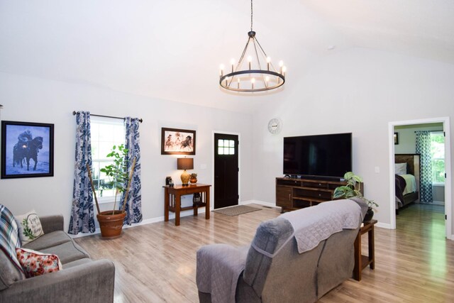 421 Marlin Ln, Westmoreland, TN 37186 - living area featuring a chandelier, healthy amount of natural light, light wood-type flooring, and lofted ceiling