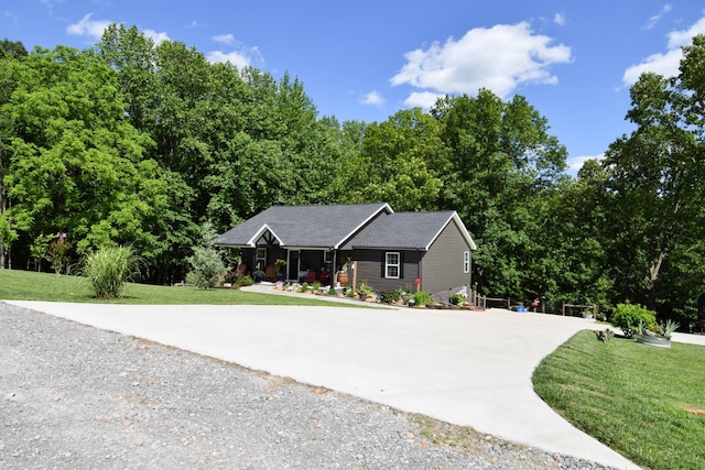 421 Marlin Ln, Westmoreland, TN 37186 - ranch-style home with concrete driveway, covered porch, and a front lawn