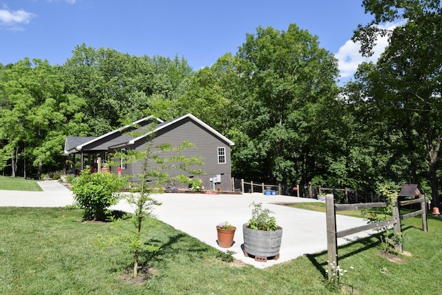421 Marlin Ln, Westmoreland, TN 37186 - view of side of home featuring a yard and a patio area