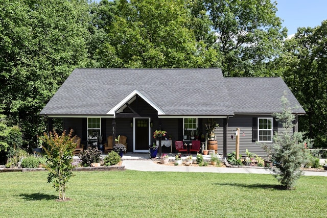 421 Marlin Ln, Westmoreland, TN 37186 - view of front of home with a porch, a front lawn, and roof with shingles
