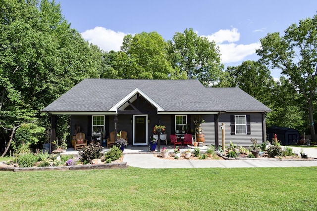 421 Marlin Ln, Westmoreland, TN 37186 - ranch-style house featuring a porch, a front yard, and roof with shingles