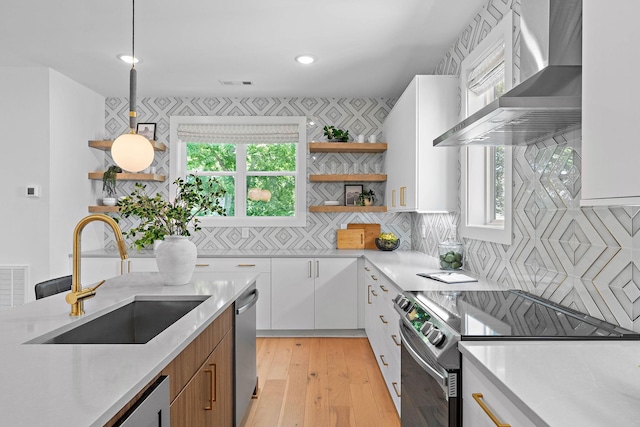 1003 Alice St Unit B, Nashville, TN 37218 - kitchen featuring open shelves, a sink, wall chimney exhaust hood, appliances with stainless steel finishes, and white cabinetry