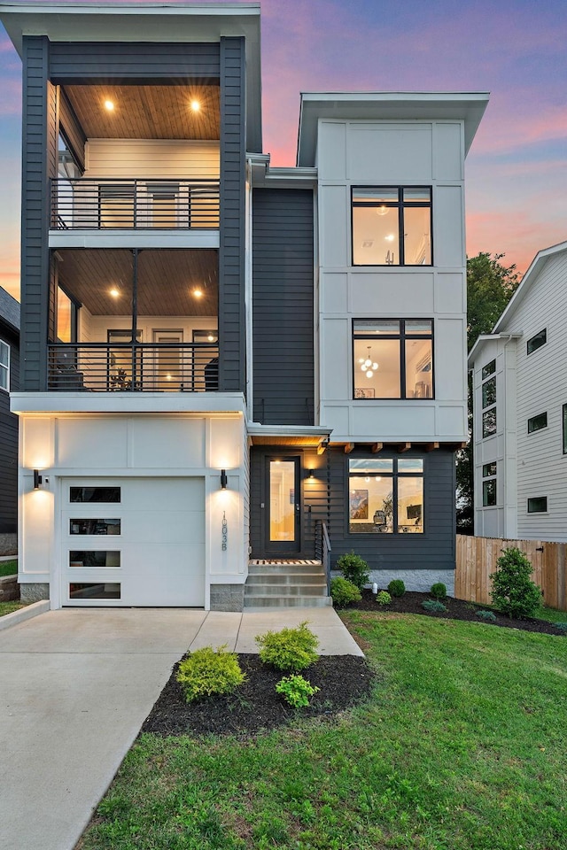 1003 Alice St Unit B, Nashville, TN 37218 - modern home with a garage, concrete driveway, and a balcony