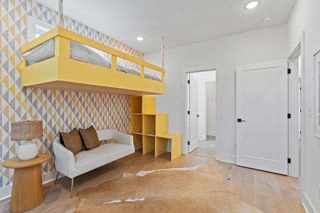 1003 Alice St Unit B, Nashville, TN 37218 - living area with wallpapered walls, hardwood / wood-style flooring, an accent wall, baseboards, and recessed lighting