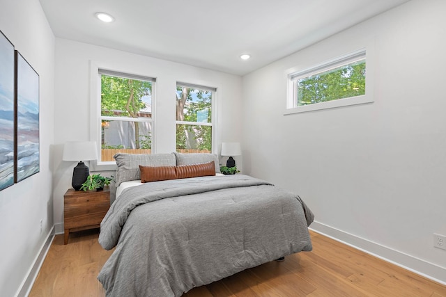 1003 Alice St Unit B, Nashville, TN 37218 - bedroom featuring multiple windows, baseboards, light wood-type flooring, and recessed lighting