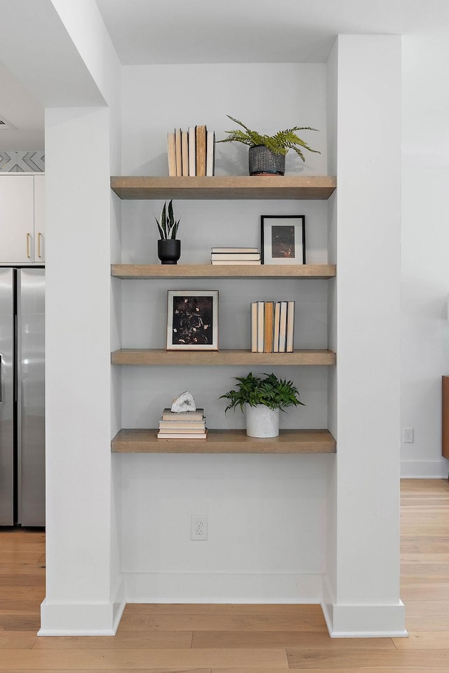 1003 Alice St Unit B, Nashville, TN 37218 - detailed view of stainless steel fridge, wood finished floors, and baseboards