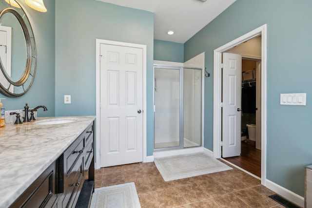 3820 Leona Pass, Hermitage, TN 37076 - full bath featuring vanity, a stall shower, tile patterned flooring, and a walk in closet
