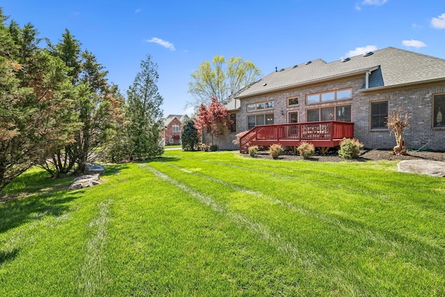 3820 Leona Pass, Hermitage, TN 37076 - rear view of house with a deck, a yard, and brick siding