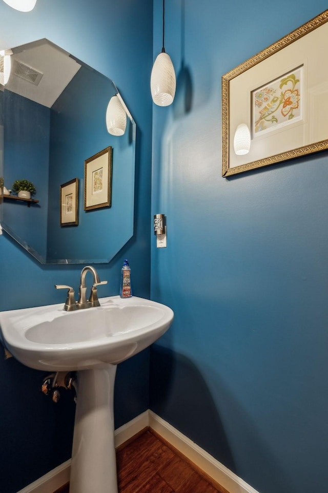 3820 Leona Pass, Hermitage, TN 37076 - bathroom featuring wood finished floors, baseboards, and a sink