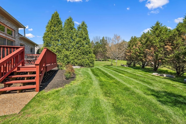 3820 Leona Pass, Hermitage, TN 37076 - view of green lawn featuring a wooden deck and stairway