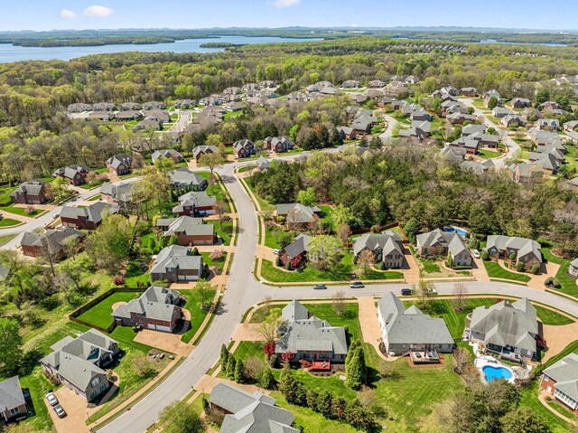 3820 Leona Pass, Hermitage, TN 37076 - aerial perspective of suburban area with a large body of water, a forest, and a pool area