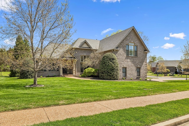 3820 Leona Pass, Hermitage, TN 37076 - view of front of house with a front yard and brick siding