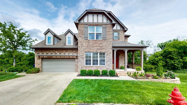 2816 Chatham Place Ct, Thompsons Station, TN 37179 - view of front of property featuring a porch, a front lawn, concrete driveway, and brick siding