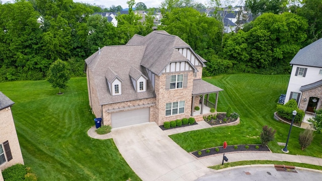 2816 Chatham Place Ct, Thompsons Station, TN 37179 - view of front of house with stone siding, concrete driveway, roof with shingles, a garage, and a front lawn