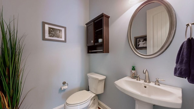 2816 Chatham Place Ct, Thompsons Station, TN 37179 - half bathroom featuring toilet, baseboards, and a sink