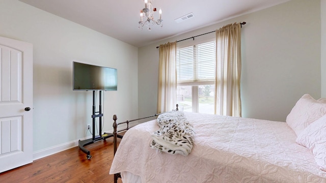 2816 Chatham Place Ct, Thompsons Station, TN 37179 - bedroom with wood finished floors, a chandelier, and baseboards