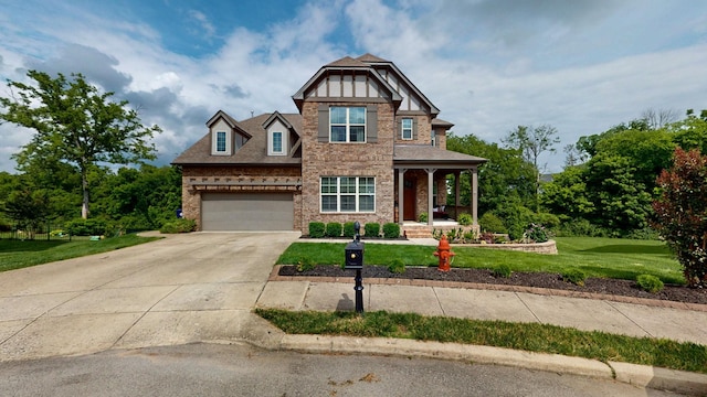 2816 Chatham Place Ct, Thompsons Station, TN 37179 - craftsman inspired home featuring concrete driveway, a front lawn, an attached garage, covered porch, and brick siding