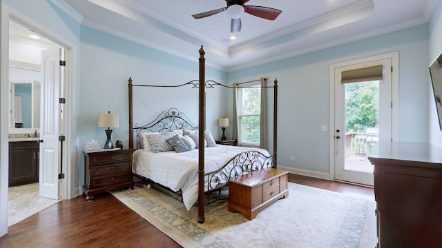 2816 Chatham Place Ct, Thompsons Station, TN 37179 - bedroom featuring multiple windows, access to exterior, wood finished floors, ornamental molding, and a tray ceiling