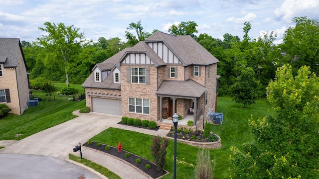 2816 Chatham Place Ct, Thompsons Station, TN 37179 - view of front facade featuring concrete driveway, a front yard, a garage, brick siding, and a porch