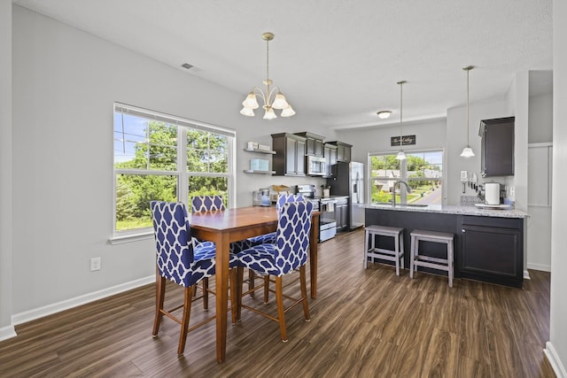 305 Jerry Butler Dr, La Vergne, TN 37086 - dining space featuring dark wood-style flooring, a chandelier, and baseboards
