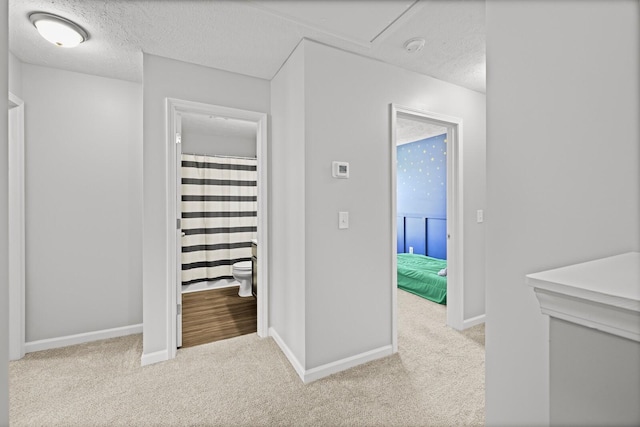 305 Jerry Butler Dr, La Vergne, TN 37086 - hall featuring a textured ceiling, carpet, and baseboards