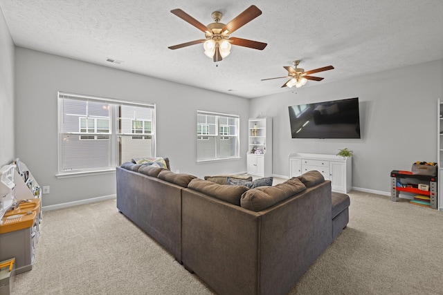 305 Jerry Butler Dr, La Vergne, TN 37086 - living area featuring a textured ceiling, light colored carpet, a ceiling fan, and baseboards