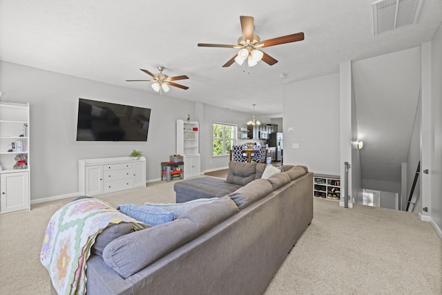 305 Jerry Butler Dr, La Vergne, TN 37086 - living area featuring light colored carpet, ceiling fan, a chandelier, and baseboards