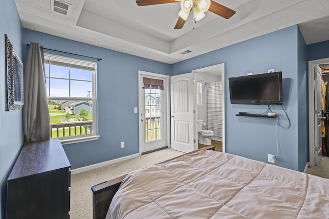305 Jerry Butler Dr, La Vergne, TN 37086 - bedroom with carpet flooring, a tray ceiling, multiple windows, and baseboards