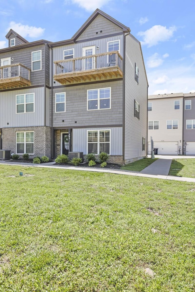 305 Jerry Butler Dr, La Vergne, TN 37086 - view of front of property featuring a balcony, board and batten siding, and a front lawn