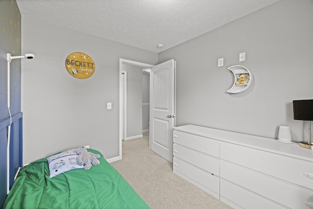 305 Jerry Butler Dr, La Vergne, TN 37086 - bedroom featuring light colored carpet, a textured ceiling, and baseboards