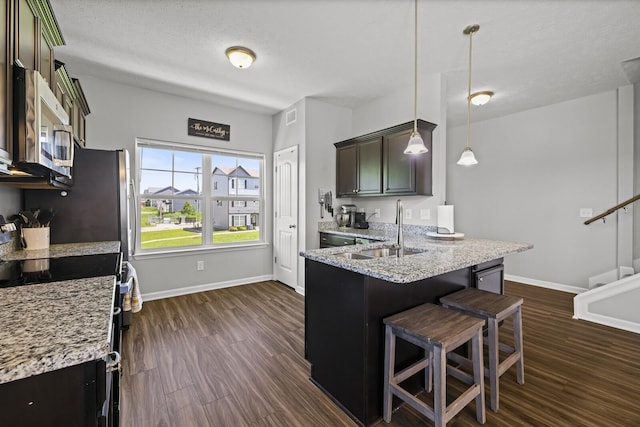 305 Jerry Butler Dr, La Vergne, TN 37086 - kitchen featuring stainless steel microwave, a sink, electric stove, dark wood-style floors, and baseboards