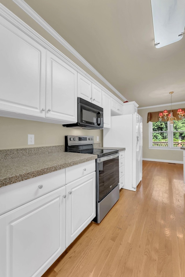 411 Royal Xing, Franklin, TN 37064 - kitchen with stainless steel range with electric cooktop, black microwave, white cabinets, light wood-style flooring, and ornamental molding