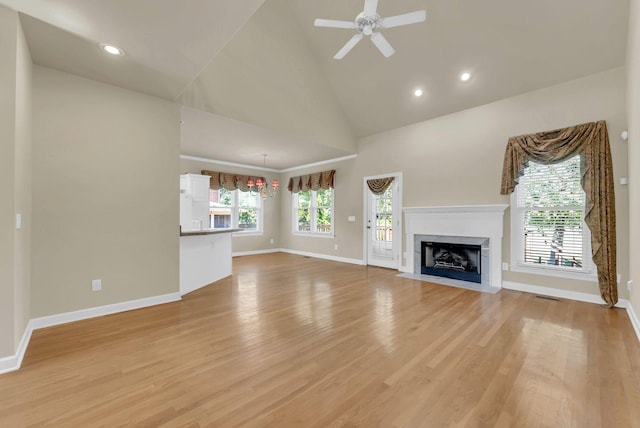 411 Royal Xing, Franklin, TN 37064 - unfurnished living room with light wood-style flooring, a ceiling fan, a fireplace with flush hearth, baseboards, and high vaulted ceiling