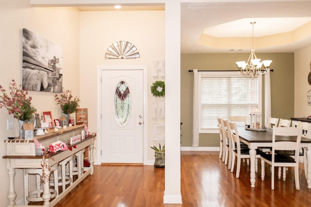 1005 Goldfinch Trl, Portland, TN 37148 - foyer featuring a chandelier, wood finished floors, baseboards, and a raised ceiling