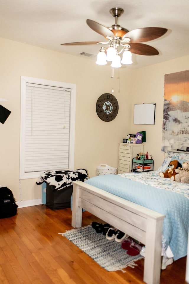 1005 Goldfinch Trl, Portland, TN 37148 - bedroom featuring wood finished floors, a ceiling fan, and baseboards