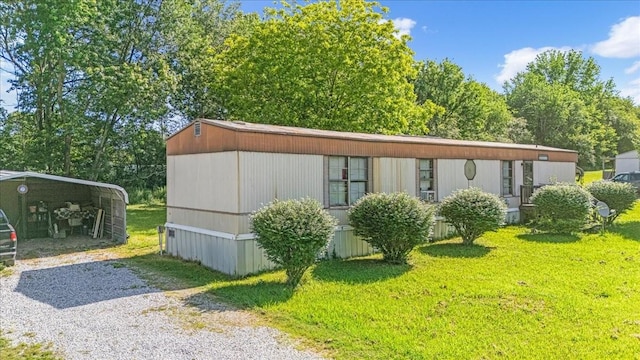 0 Ez Ln, Manchester, TN 37355 - view of front of house featuring driveway, a front lawn, and a carport