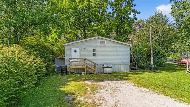 0 Ez Ln, Manchester, TN 37355 - view of side of property featuring stairs, a yard, and view of scattered trees