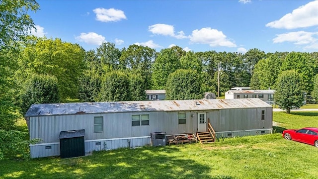 0 Ez Ln, Manchester, TN 37355 - rear view of property featuring entry steps, a lawn, and cooling unit