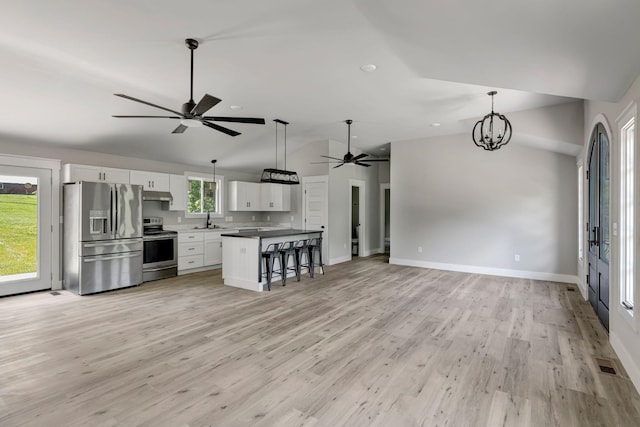 120 E Boiling Springs Rd E, Portland, TN 37148 - kitchen featuring stainless steel appliances, a sink, vaulted ceiling, a ceiling fan, and open floor plan