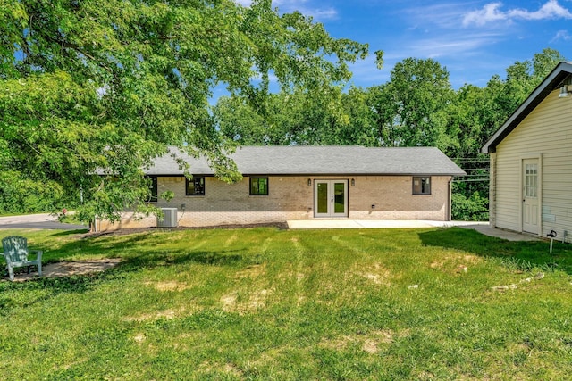 120 E Boiling Springs Rd E, Portland, TN 37148 - rear view of house with french doors, a yard, central AC unit, and brick siding