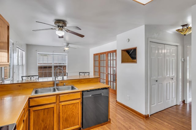1510 Walnut Hills Dr, Chapel Hill, TN 37034 - kitchen with dishwasher, light wood-type flooring, ceiling fan, light countertops, and brown cabinets