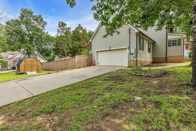 1510 Walnut Hills Dr, Chapel Hill, TN 37034 - view of property exterior featuring an attached garage, driveway, and a storage unit