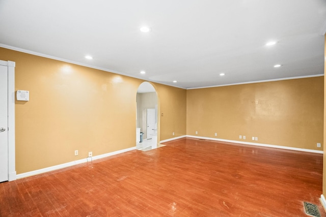 723 Vanderhorst Dr, Nashville, TN 37207 - empty room featuring arched walkways, recessed lighting, crown molding, wood finished floors, and baseboards