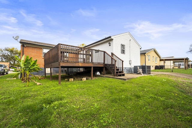 723 Vanderhorst Dr, Nashville, TN 37207 - back of house with central air condition unit, a lawn, and a wooden deck