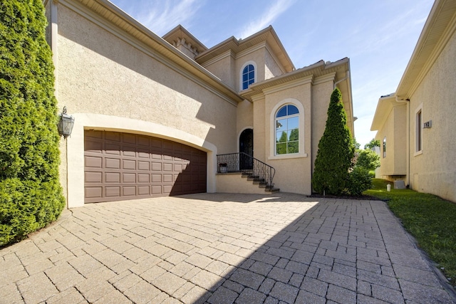 891 Fairington Pvt Way, Gallatin, TN 37066 - mediterranean / spanish-style house featuring stucco siding, driveway, and a garage