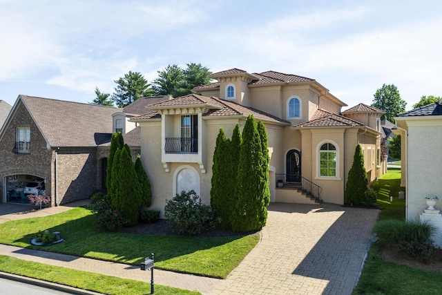 891 Fairington Pvt Way, Gallatin, TN 37066 - mediterranean / spanish-style house featuring stucco siding and a front lawn